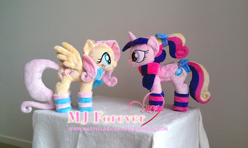 Fluttershy and Foalsitter Princess Cadance in their winter gear!  Both by navkaze